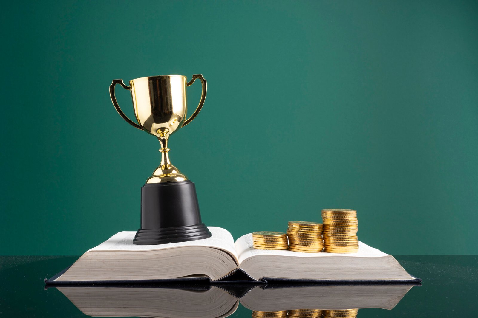 Stacking coins and book with financial concept.